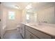 Well-lit bathroom with double sinks, modern faucets, and a large mirror at 196 Abingdon Farms Dr, Selma, NC 27576