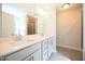 Bathroom with dual sink vanity, large mirror, and tile floors at 196 Abingdon Farms Dr, Selma, NC 27576