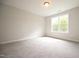 Spacious bedroom with a large window offering a view of the outdoors at 196 Abingdon Farms Dr, Selma, NC 27576