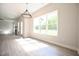 Dining area with large window offering plenty of natural light and backyard views at 196 Abingdon Farms Dr, Selma, NC 27576