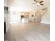 Open-concept view of living room into kitchen featuring an island and modern cabinets at 196 Abingdon Farms Dr, Selma, NC 27576