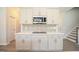 Modern kitchen with an island, stainless steel appliances, and decorative tile backsplash at 196 Abingdon Farms Dr, Selma, NC 27576