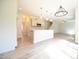 Open floor plan with kitchen island, modern appliances, and views of dining area at 196 Abingdon Farms Dr, Selma, NC 27576