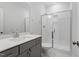 Modern bathroom featuring a sleek vanity with solid surface counter and walk-in shower at 232 Berry Mill Ln # 201, Raleigh, NC 27603
