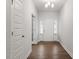 Bright entryway features hardwood floors, white trim, and a clear view of the home's interior design at 232 Berry Mill Ln # 201, Raleigh, NC 27603