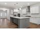 Beautiful kitchen with stainless steel appliances, granite countertops, and a large center island at 232 Berry Mill Ln # 201, Raleigh, NC 27603