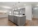 Open kitchen with granite countertops, stainless steel appliances, and access to the living area at 232 Berry Mill Ln # 201, Raleigh, NC 27603