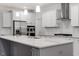 Spacious kitchen with stainless steel appliances, granite countertops, and a large center island at 232 Berry Mill Ln # 201, Raleigh, NC 27603