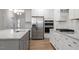 Large kitchen island with granite countertops, stainless steel appliances, and lots of cabinet space at 232 Berry Mill Ln # 201, Raleigh, NC 27603