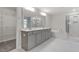 Luxurious main bathroom with double vanity, soaking tub, separate shower, and walk-in closet entrance at 232 Berry Mill Ln # 201, Raleigh, NC 27603