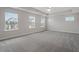 Spacious main bedroom featuring plush carpet, multiple windows for natural light, and neutral decor at 232 Berry Mill Ln # 201, Raleigh, NC 27603