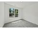 Bedroom featuring plush carpet, a large window and lots of light at 242 Sequoia Dr, Louisburg, NC 27549