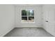 Bright, carpeted bedroom features a large window and a door at 242 Sequoia Dr, Louisburg, NC 27549