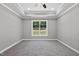 Inviting bedroom with neutral walls, modern ceiling fan, and sunlit window view at 242 Sequoia Dr, Louisburg, NC 27549