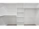 Walk-in closet with carpeted flooring and white shelving and racks at 242 Sequoia Dr, Louisburg, NC 27549