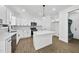 Contemporary kitchen with stainless steel appliances, an island, and ample counter space at 242 Sequoia Dr, Louisburg, NC 27549