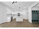 Well-appointed kitchen with white cabinetry, stainless steel appliances, and an island at 242 Sequoia Dr, Louisburg, NC 27549