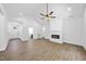 Spacious living area with a fireplace and seamless access to other areas of the home at 242 Sequoia Dr, Louisburg, NC 27549