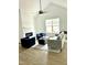 Bright living room featuring modern furniture, a fireplace, and a ceiling fan at 242 Sequoia Dr, Louisburg, NC 27549