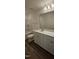 Bathroom offering a sleek white vanity, mirror, and tub-shower combo at 466 Saint Clair Dr, Fuquay Varina, NC 27526