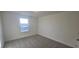 Inviting carpeted bedroom featuring abundant natural light and neutral walls at 466 Saint Clair Dr, Fuquay Varina, NC 27526