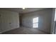 This bedroom provides comfort with carpet and a closet at 466 Saint Clair Dr, Fuquay Varina, NC 27526