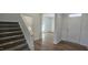 Bright foyer with hardwood floors and staircase, leading to the upper level at 466 Saint Clair Dr, Fuquay Varina, NC 27526
