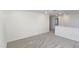 Spacious loft area with carpeted floors and access to other rooms at 466 Saint Clair Dr, Fuquay Varina, NC 27526