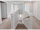 Carpeted staircase with white painted railing and walls leading to an upper level at 120 Whistling Way # Cary Traditiol, Lillington, NC 27546