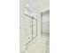 Modern bathroom featuring a glass-enclosed shower and a view into a walk in closet at 2048 Abbeyhill Dr # 98, Raleigh, NC 27610