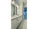 Bright bathroom featuring double sinks and quartz countertops at 2048 Abbeyhill Dr # 98, Raleigh, NC 27610