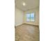 A bedroom has wooden floors and lots of natural light at 2048 Abbeyhill Dr # 98, Raleigh, NC 27610