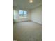 Spacious bedroom with plush carpeting, tray ceiling, and a window with a pleasant outdoor view at 2048 Abbeyhill Dr # 98, Raleigh, NC 27610