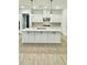 A well-appointed kitchen island is the focal point of this modern kitchen at 2048 Abbeyhill Dr # 98, Raleigh, NC 27610