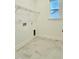 Bright laundry room with tile floor and a window at 2048 Abbeyhill Dr # 98, Raleigh, NC 27610