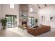 Comfortable living room featuring a stone fireplace, TV, chandelier, and modern furnishings at 2048 Abbeyhill Dr # 98, Raleigh, NC 27610