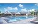 Community pool featuring zero entry, water slide, lounge seating, and shaded areas for residents at 2048 Abbeyhill Dr # 98, Raleigh, NC 27610