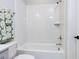 Bright bathroom featuring a white subway tile shower and tub combo, with a patterned towel and modern fixtures at 809 St Charles St, Durham, NC 27713
