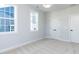 Bedroom with neutral carpet and two windows allowing lots of natural light at 809 St Charles St, Durham, NC 27713