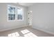 Bright bedroom with large windows and neutral carpet at 809 St Charles St, Durham, NC 27713