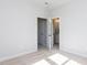 Spacious bedroom featuring neutral carpet, fresh paint, with a view of the ensuite bathroom at 809 St Charles St, Durham, NC 27713