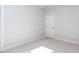 Minimalist bedroom with carpet and a white door at 809 St Charles St, Durham, NC 27713