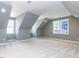 Large bonus room with gray walls, angled ceilings, and plenty of natural light at 809 St Charles St, Durham, NC 27713