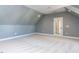 Bonus room featuring carpeted floors and a door with glass panes at 809 St Charles St, Durham, NC 27713