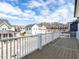 View from a deck of neighborhood homes under a bright blue sky at 809 St Charles St, Durham, NC 27713
