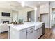 Gourmet kitchen featuring a large island with sink and seating, stainless appliances, and white countertops at 809 St Charles St, Durham, NC 27713