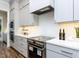 Modern kitchen featuring stainless steel appliances, white countertops, and gas cooktop at 809 St Charles St, Durham, NC 27713