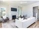 Spacious living room boasts fireplace, hardwood floors, neutral colors and decor at 809 St Charles St, Durham, NC 27713
