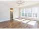 Light-filled main bedroom featuring hardwood floors, plenty of natural light, and an ensuite bathroom at 809 St Charles St, Durham, NC 27713