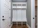 Organized mudroom with built-in storage cubbies, bench seating, and hooks, perfect for entryway organization at 809 St Charles St, Durham, NC 27713